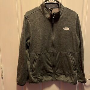 The North Face women’s long sleeve full zip grey fleece jacket. Pre-owned.